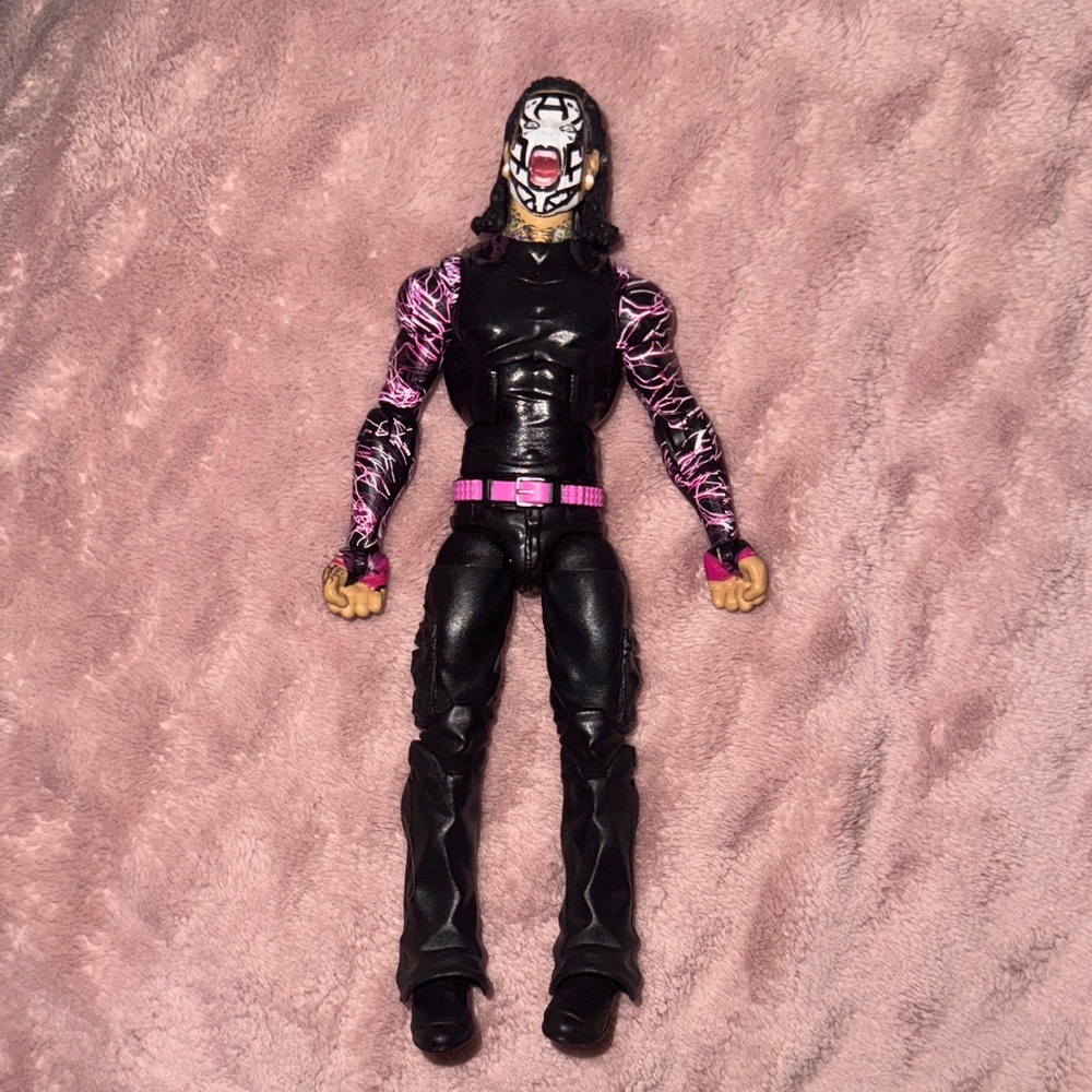 Mattel Action Figure with Black and Pink Design